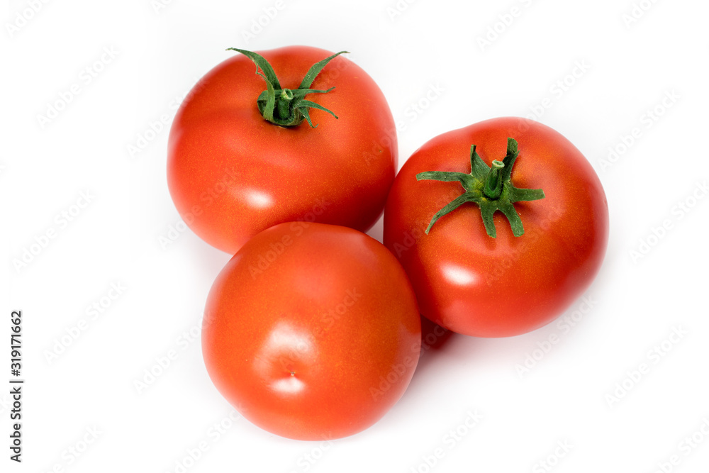 three fresh tomatoes with green leaves isolated on white background three fresh tomatoes with green leaves isolated on white background