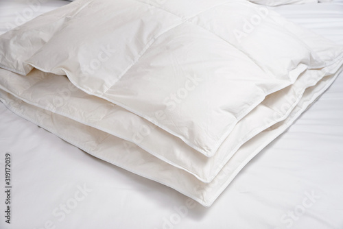 White blanket (quilt) on the bed