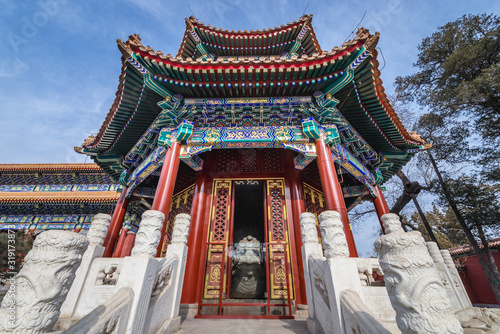 Rounded pavilion in area of ancient Shouhuang Palace located in Jingshan Park, former imperial park in Beijing, capital city of China photo