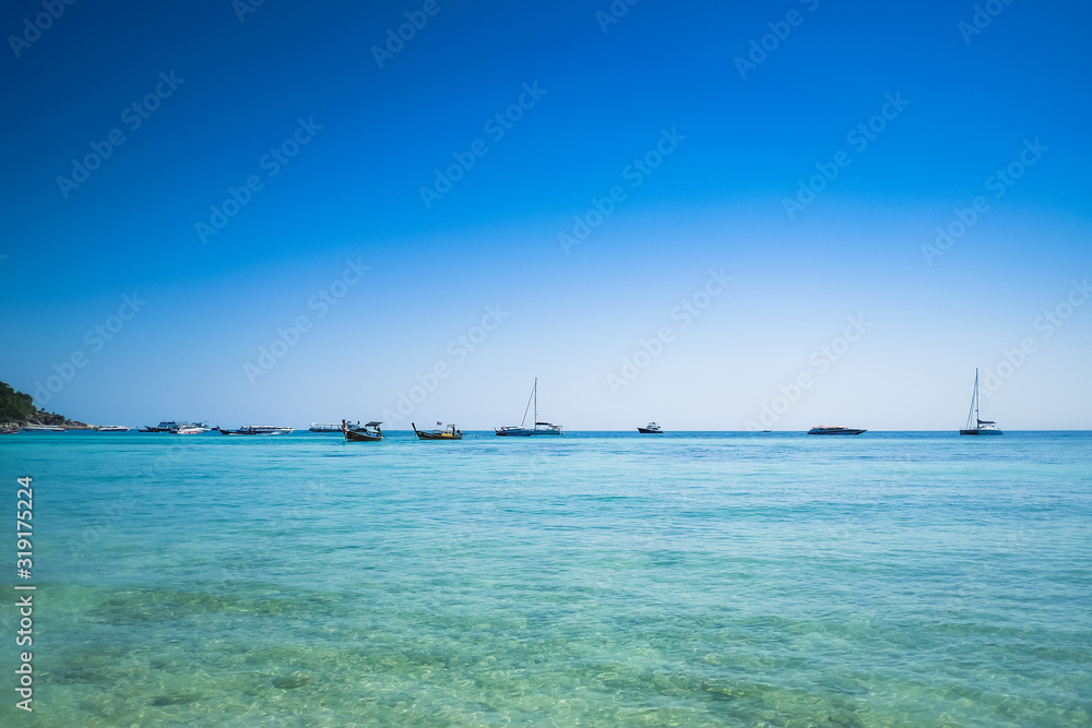 Beautiful view of  blue sea with blue sky at Pattaya beach, Lipe island, Satun, Thailand.  Perfect tropical, exotic nature view. Vacation concept.