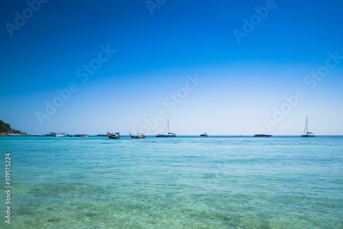 Beautiful view of  blue sea with blue sky at Pattaya beach, Lipe island, Satun, Thailand.  Perfect tropical, exotic nature view. Vacation concept. © Missleestocker