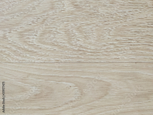 Wooden background made of natural wood planks parquet with pattern of lines and knot as a beige wallpaper used in home decoration