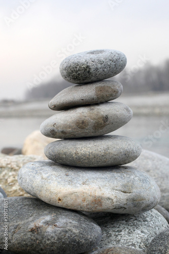 zen stone concept: piled stone on a river side with copy space for your text