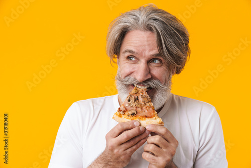 Emotional senior man holding pizza.
