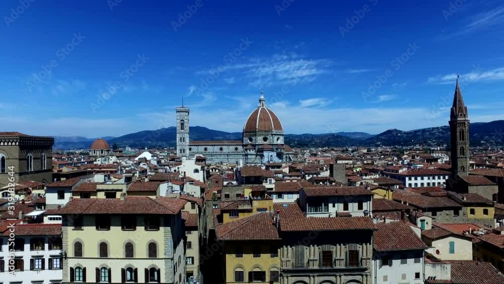 4K: Florence, Italy skyline / Cityscape with the Duomo dominating the view. Blue Sky over the rooftops 4K: Florence, Italy skyline / Cityscape with the Duomo dominating the view. Blue Sky over the rooftops