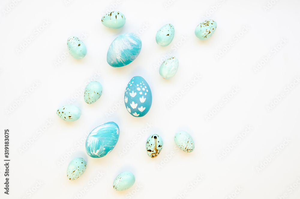 Top view pastel blue decorated Easter eggs isolated on white. Handcrafted Easter chicken and quail eggs. Handmade festive paint Top view pastel blue decorated Easter eggs isolated on white. Handcrafted Easter chicken and quail eggs. Handmade festive paint