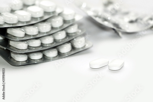 White pills. Blister. Packing pills. Allergy. Disease. Health. Medical treatment.