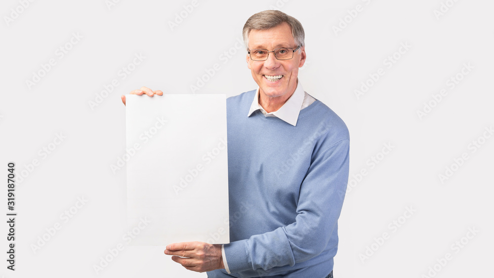 Cheerful Elderly Man Holding Blank Poster, Studio Shot, Panorama Cheerful Elderly Man Holding Blank Poster, Studio Shot, Panorama