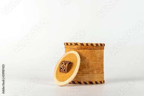 Basket of birch bark (Tuesok) with a lid on a white background. Food container photo