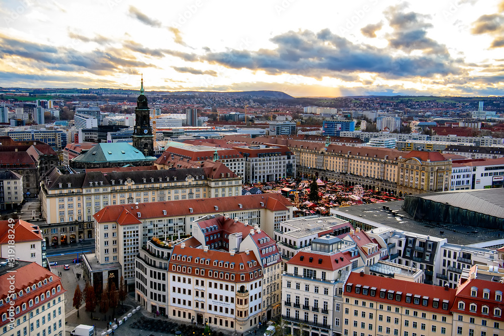 Panoramic view of Dresden city with old buildings at sunset from church of Our Lady Frauenkirche, Germany. November 2019