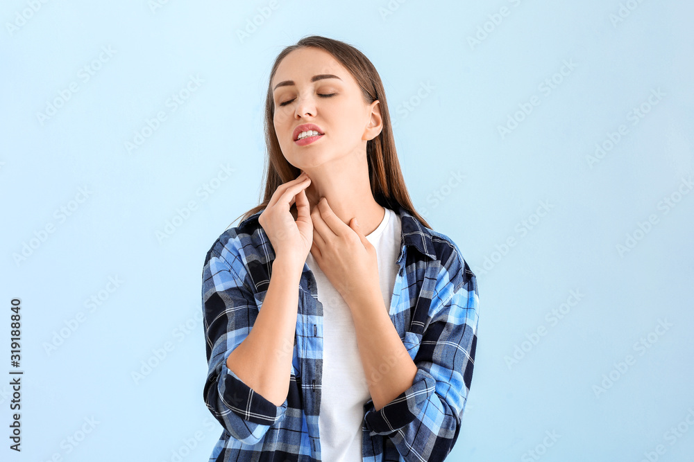 Scratching allergic woman on color background Scratching allergic woman on color background