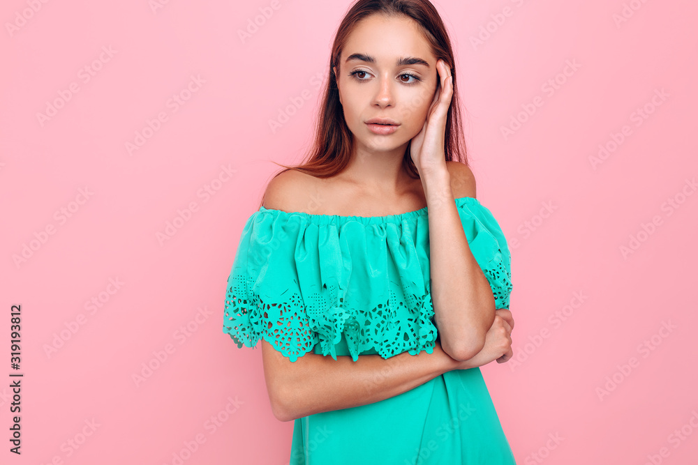 Pensive cute young woman on pink background Pensive cute young woman on pink background