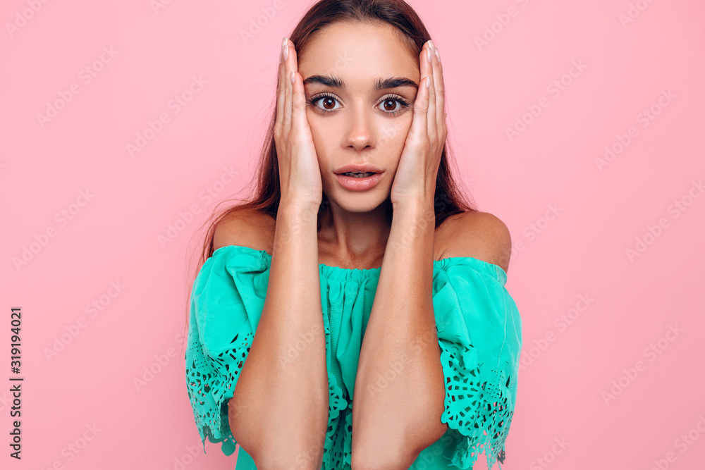 Shocked beautiful young woman, on a pink background Shocked beautiful young woman, on a pink background