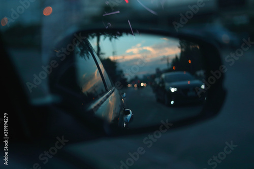 vehicle car travel road trips at town with twilight sky view on sideview of mirror