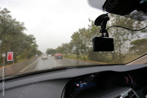 video camera recorder inside car driving rainy day