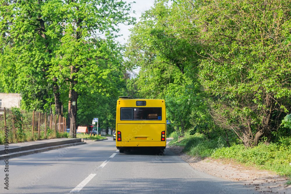 Fototapeta premium public transport bus rides in spring streets