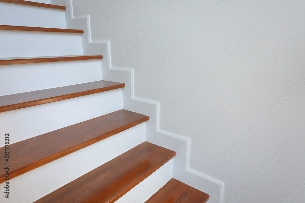 brown wooden stair and white wall in residential house brown wooden stair and white wall in residential house