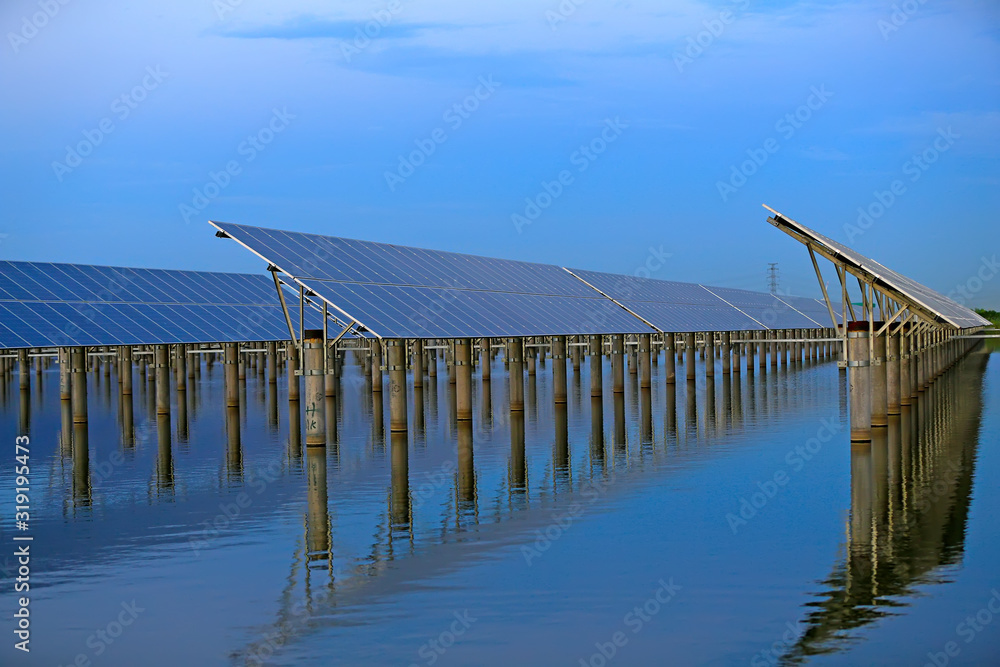 Solar photovoltaic panels in the water, in the sunset sky background