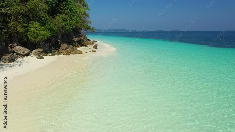 Aerial view of ocean waves, beach and rocky coastline and beautiful forest. Nyaung Oo Phee Island Myanmar Aerial view of ocean waves, beach and rocky coastline and beautiful forest. Nyaung Oo Phee Island Myanmar