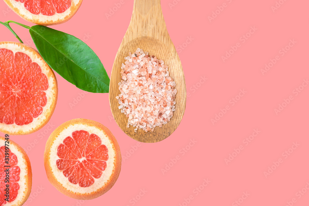 Φωτογραφία Ayurveda face skin scrub ingredients Himalayan salt in wooden spoon sliced grapefruit green leaf on cherry pink background
