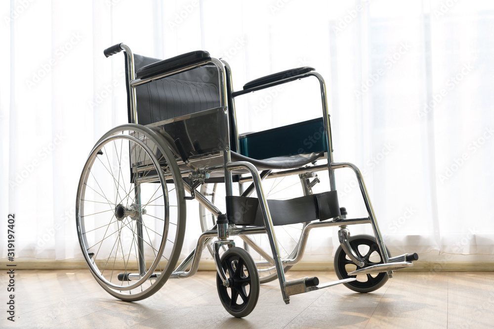Wheelchair in hospital room background with comfortable medical equipped in a hospital.