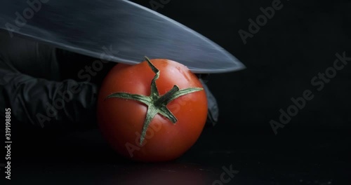 red fresh tomato close-up cut with a knife