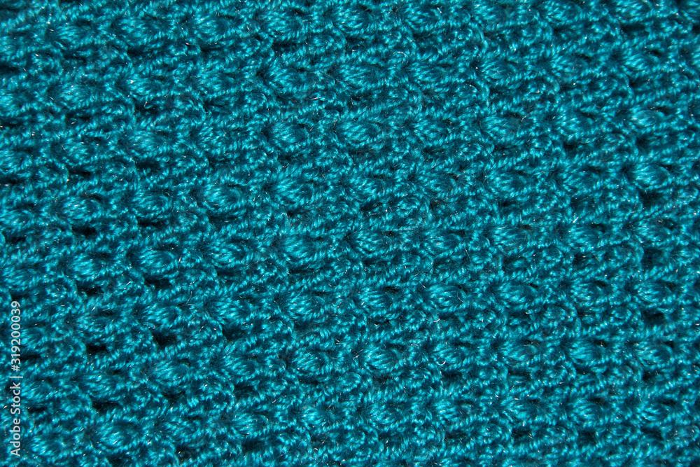 Texture of blue binding in holes. Knitted pattern. Original binding of the canvas.