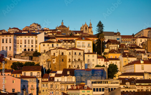 Old town of coimbra glows at night under a pretty summer sky, Portugal