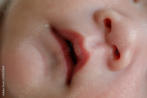 close up mouth and nose newborn baby softness sensitive skin