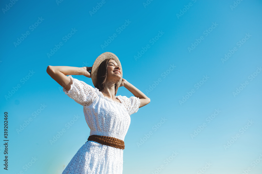 Attractive young woman catching the sunlight. Female outdoors. Lady on wild nature. Freedom. Attractive young woman catching the sunlight. Female outdoors. Lady on wild nature. Freedom.