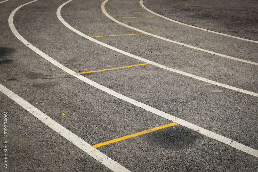 black tarmac asphalt of running track, athletic sport background