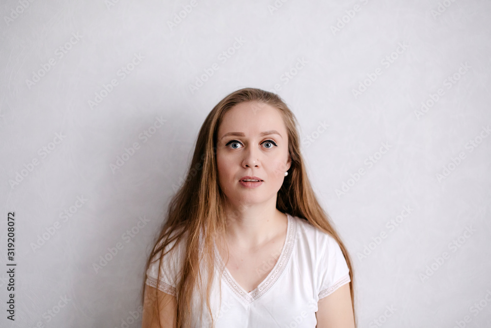 Close-up portrait of young attractive woman with long hair and serene facial expression Close-up portrait of young attractive woman with long hair and serene facial expression