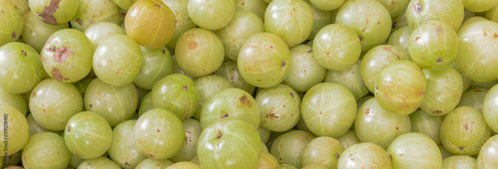 Panoramic view ripe organic Indian gooseberries background top view Panoramic view ripe organic Indian gooseberries background top view