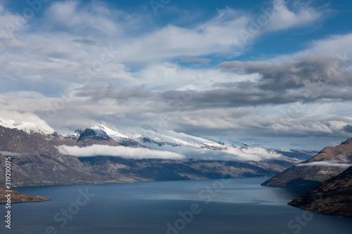Queenstown New Zealand. Mountains. Clouds. Snow. Aerial. Lake Wakatipu © A
