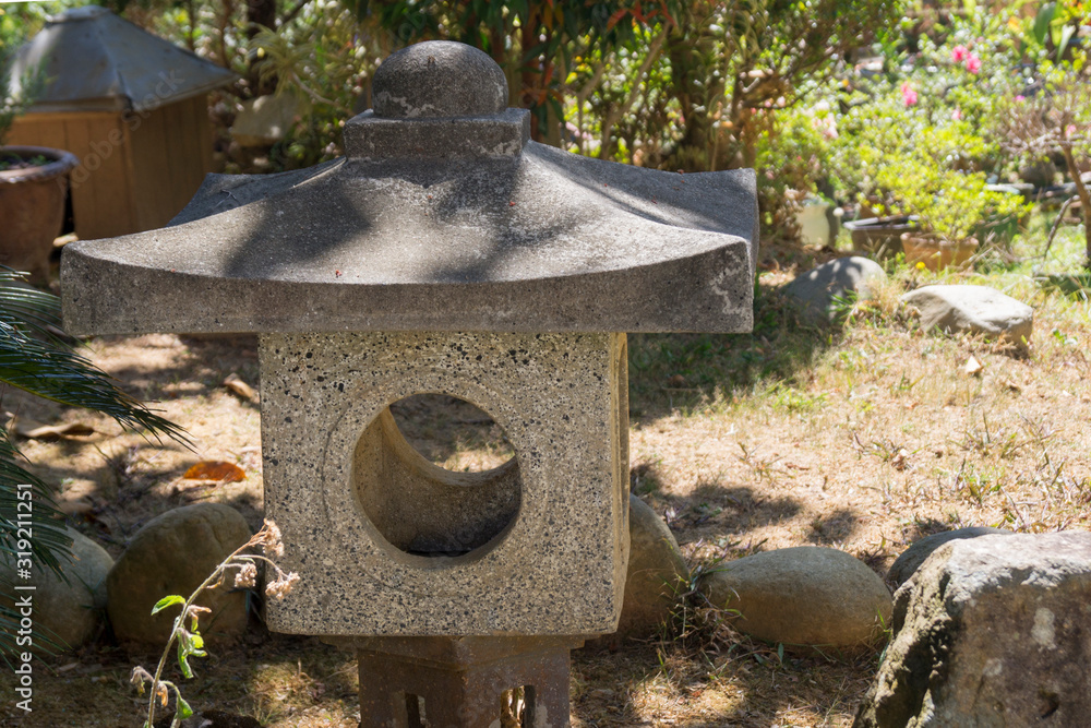  stone gray buddhist lantern in a monastery in asia