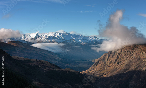 Queenstown New Zealand. Mountains. Clouds. Snow. Aerial. Lake Wakatipu