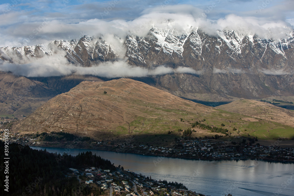 Queenstown New Zealand. Mountains. Clouds. Snow. Aerial. Lake Wakatipu