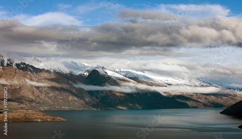 Queenstown New Zealand. Mountains. Clouds. Snow. Aerial. Lake Wakatipu