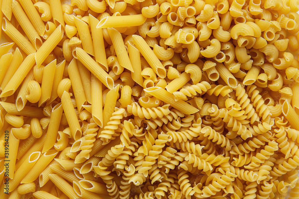 Top view Heap of various uncooked pasta Top view Heap of various uncooked pasta