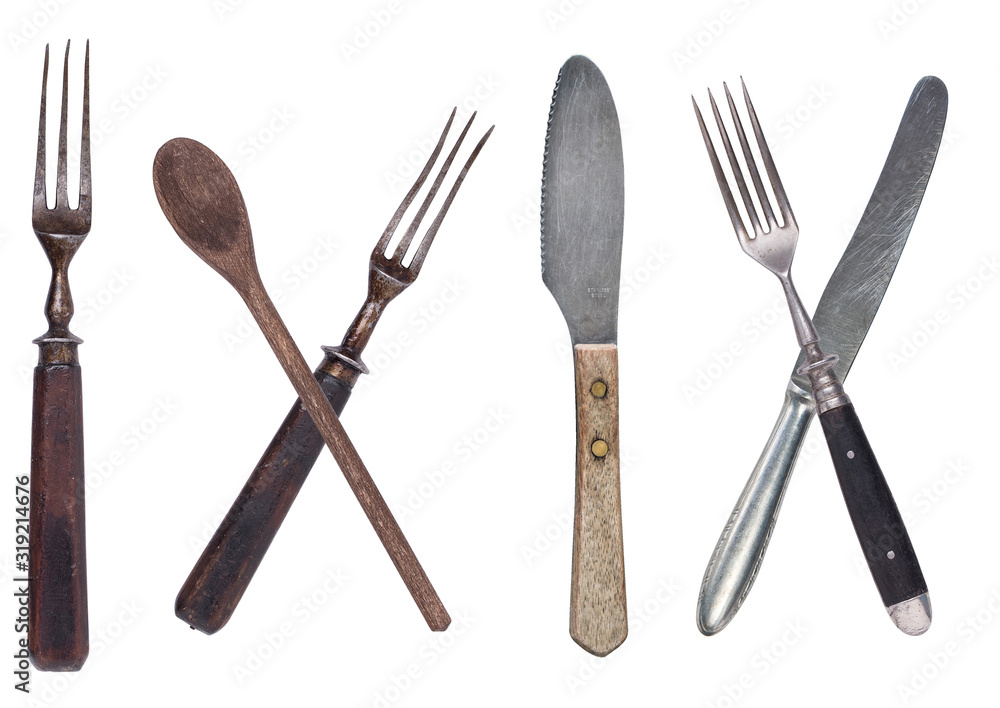 Fototapeta premium Beautiful old vintage fork and knife isolated on white background. Top view. Retro silverware
