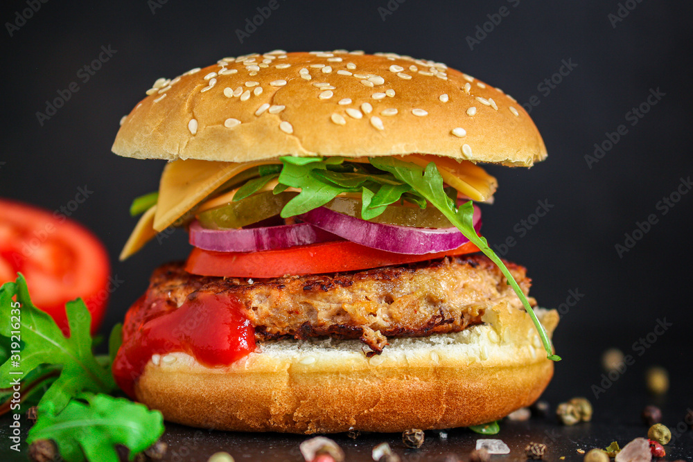 burger, meat cutlet beef steak, tomato, sauce and lettuce (tasty meat snack sandwich) menu concept. food background. top view. copy space
