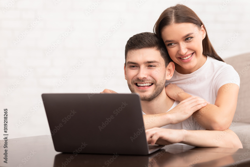 Guy Working On Laptop Sitting With Girlfriend On Couch Indoor Guy Working On Laptop Sitting With Girlfriend On Couch Indoor
