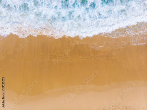 Sea white sand beach with turquoise sea water aerial view