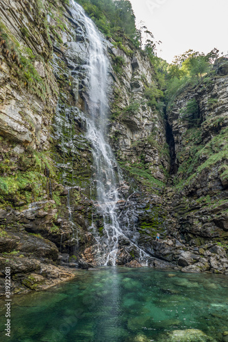Froda waterfall in Val Verzasca with green water (switzerland)