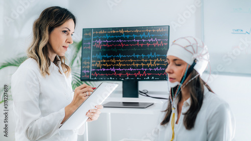 Female Patient in a Neurology Lab doing EEG Scan photo
