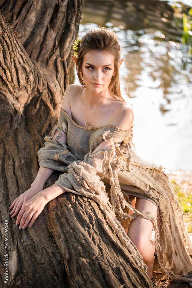 Fototapeta premium elf.beautiful girl. fantasy young woman in woods