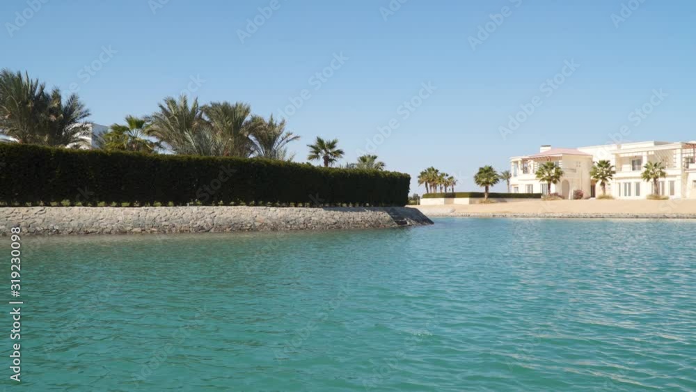 View of hotels and houses from a boat floating on channels of El Gouna Egypt