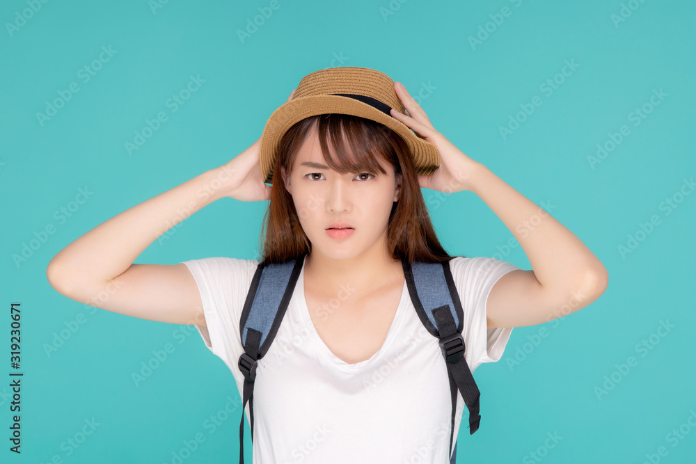 Fototapeta premium Beautiful young asian woman upset and worry travel summer trip in abroad isolated on blue background, tourist asia girl having problem and stress journey in vacation for leisure, holiday concept.