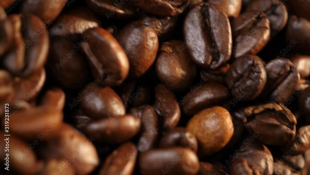 Beautiful grains. Coffee in the can. Coffee beans. Coffee. Black background. Close-up. Beautiful grains. Coffee in the can. Coffee beans. Coffee. Black background. Close-up.