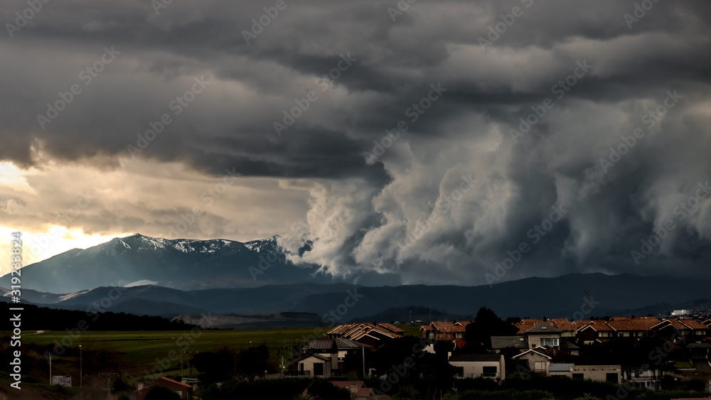 Heavy storm clouds above a town